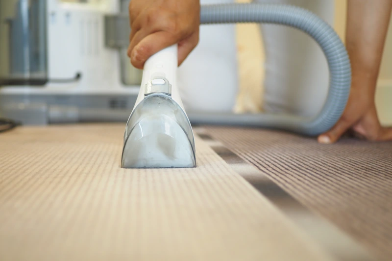 a-closeup-view-of-vacuuming-a-carpet-in-a-contempo-2024-12-13-14-23-46-utc